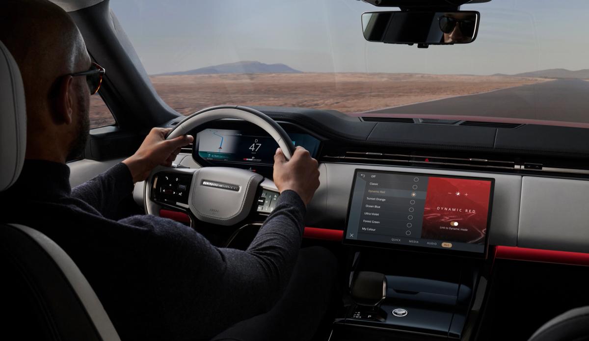 An interior of a modern car with a focus on the dashboard and steering wheel.